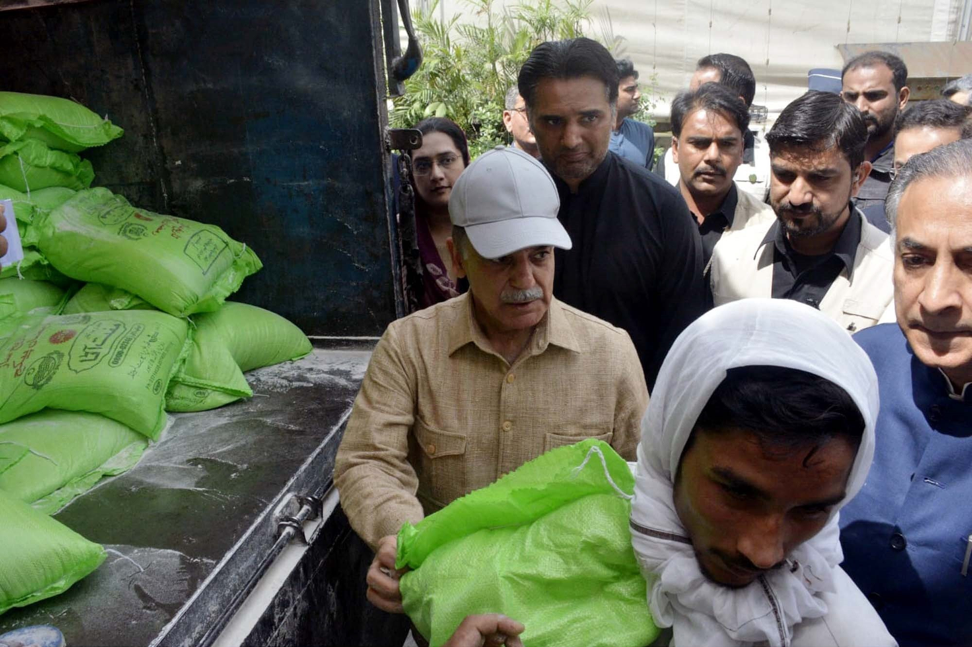 pm shehbaz sharif distributes free flour bags among the poor in multan photo ppi