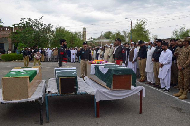 relatives and security officials prepare to offer funeral prayers for the martyred policemen in peshawar photo afp relatives and security officials prepare to offer funeral prayers for the martyred policemen in peshawar photo afp