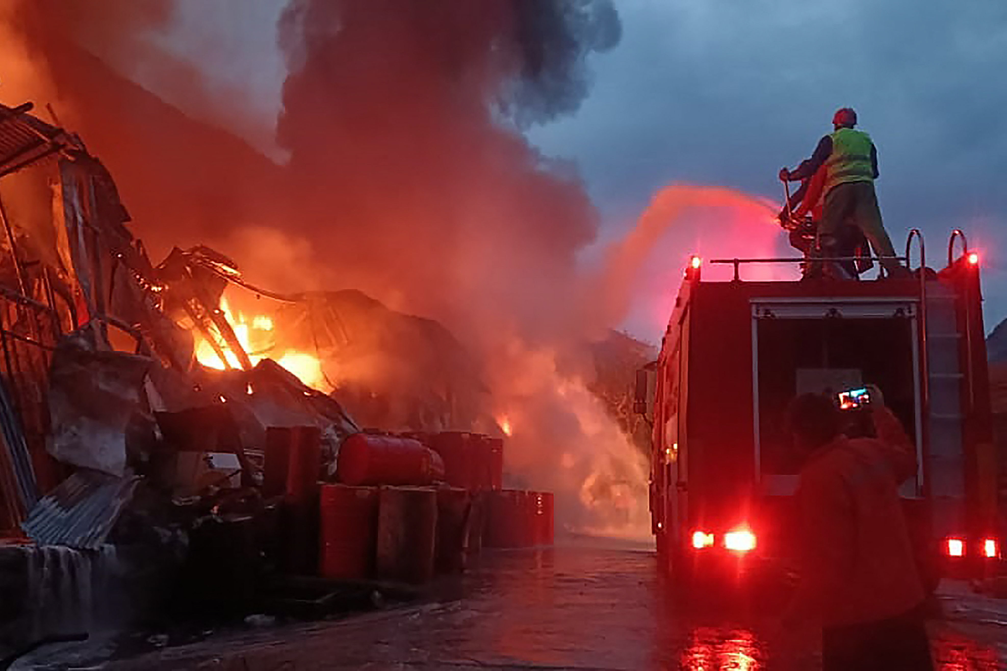 firefighters try to extinguish a fire that erupted at a warehouse of a hydropower dam construction site in dasu the main town in upper kohistan district of khyber pakhtunkhwa photo afp