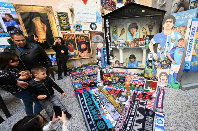 scarves and paraphernalia dedicated to the ssc napoli club and to argentinian football legend diego maradona are displayed in the quartieri spagnoli district of naples file photo alberto pizzoli afp scarves and paraphernalia dedicated to the ssc napoli club and to argentinian football legend diego maradona are displayed in the quartieri spagnoli district of naples file photo alberto pizzoli afp