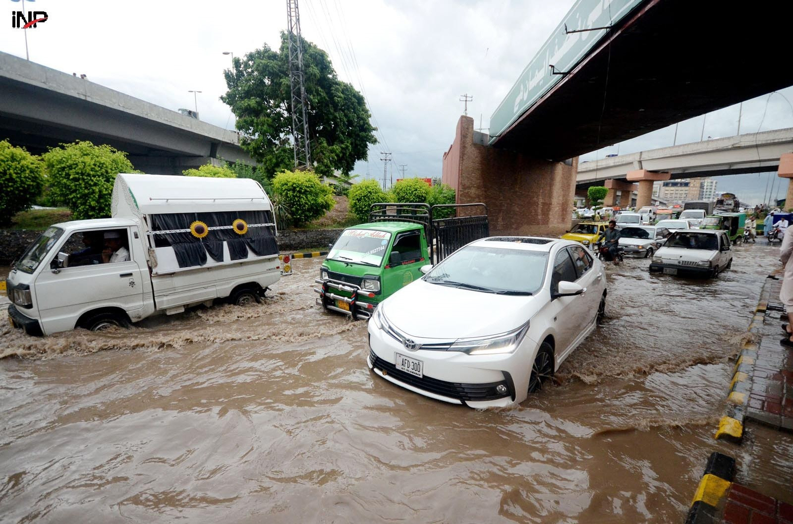 vehicles are inundated in rainwater as showers hit various parts of peshawar photo inp