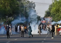 pti supporters clash with police during a protest against imran s arrest in lahore photo afp