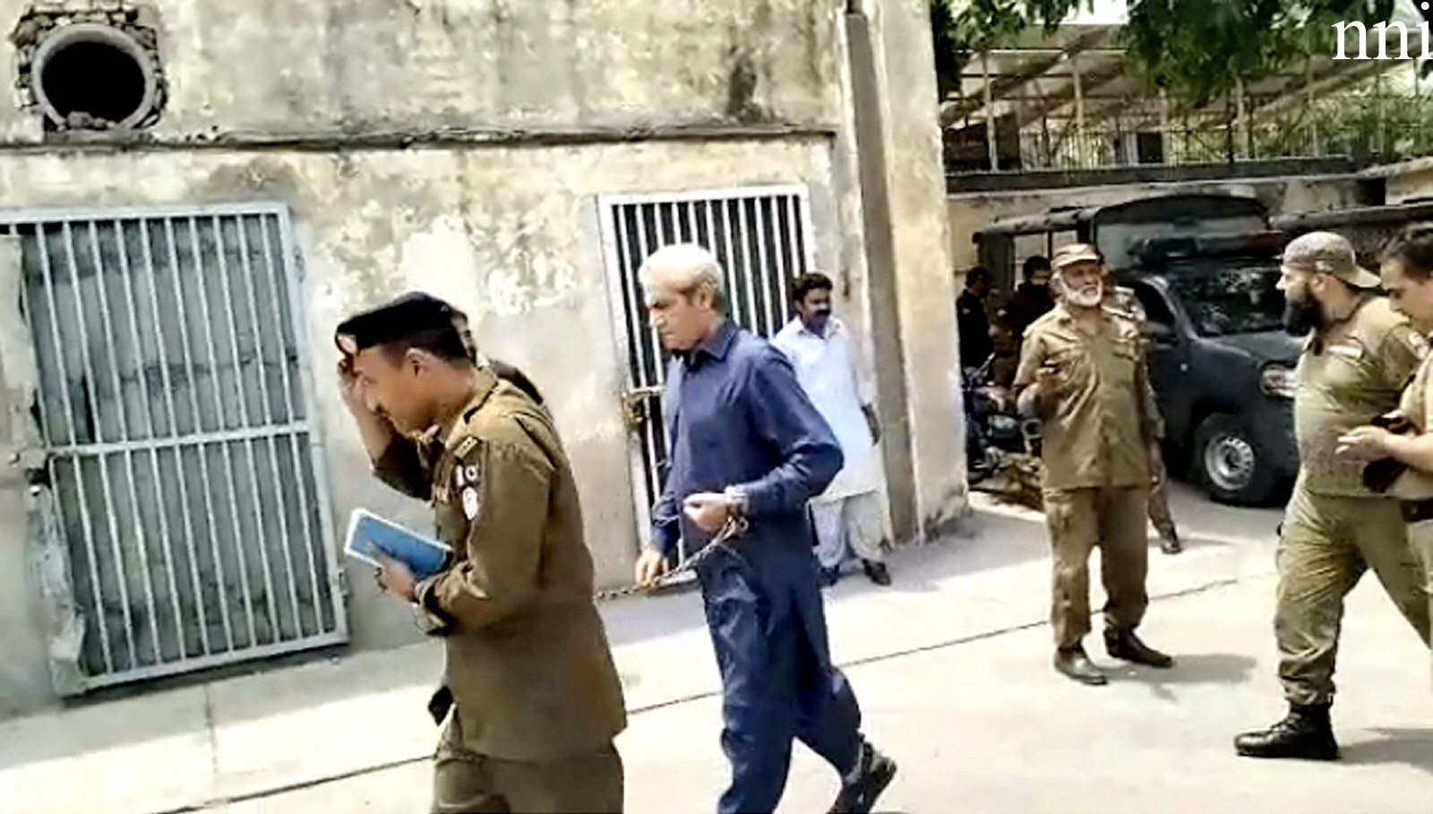 pti leader and former punjab governor omer cheema being taken to a court in lahore photo nni