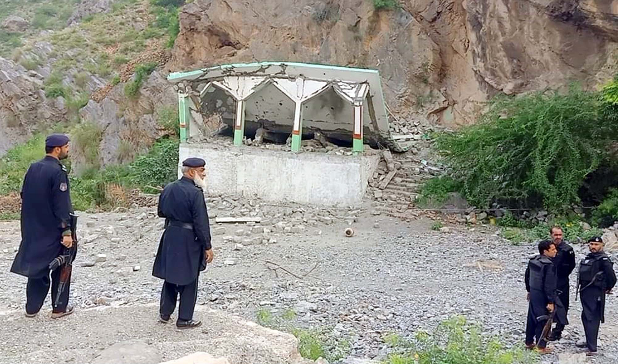 security personnel gather around the site of a suicide blast in jamrud area of khyber district photo ppi