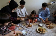 marwa 18 and others have lunch at a rented house while waiting for their special visa created by western governments to protect the afghans in rawalpindi photo reuters