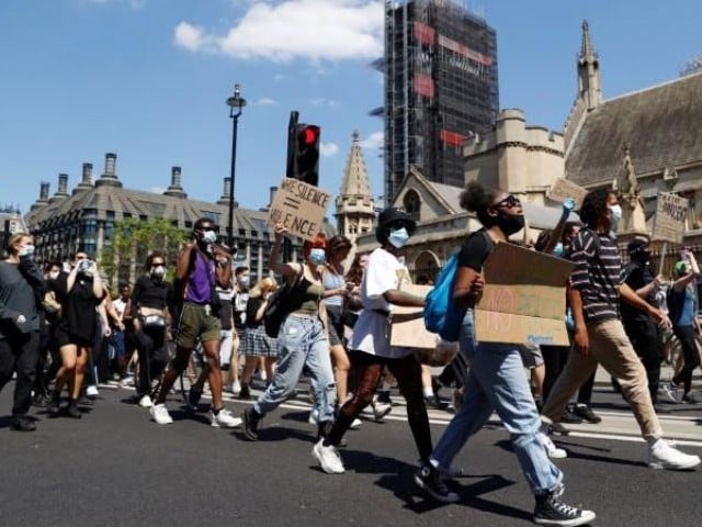 people react during a protest against the death in minneapolis police custody of african american man george floyd in parliament square london britain photo reuters