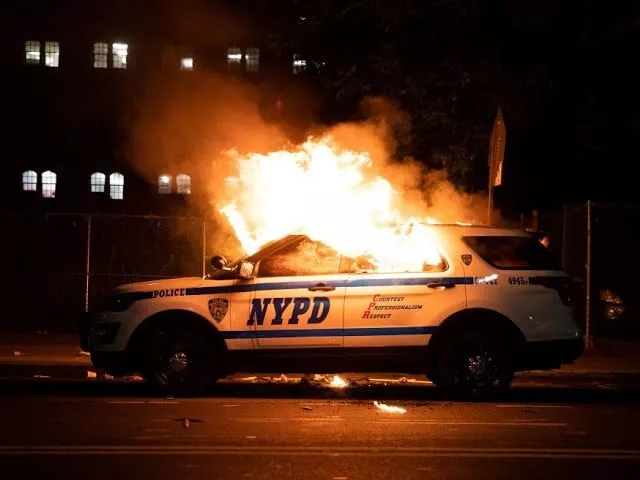 a nypd police car is set on fire as protesters clash with police during a march against the death in minneapolis police custody of george floyd in brooklyn new york on may 30 photo reuters a nypd police car is set on fire as protesters clash with police during a march against the death in minneapolis police custody of george floyd in brooklyn new york on may 30 photo reuters