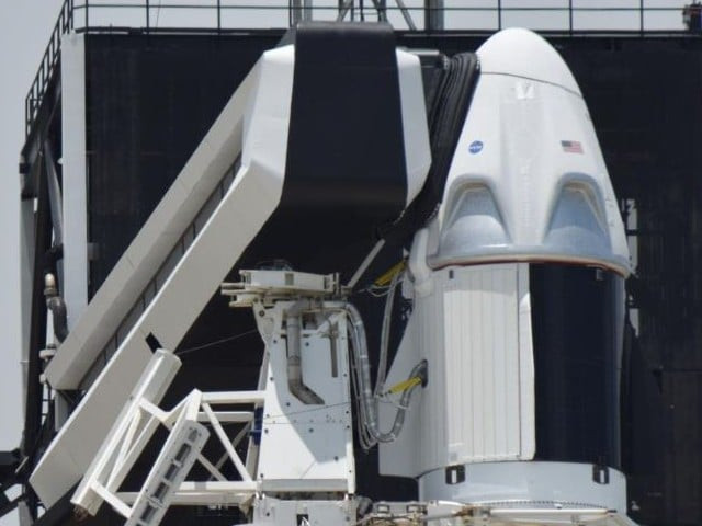 the spacex crew dragon spacecraft atop a falcon 9 booster rocket is connected to the crew access arm and launch tower on pad39a at the kennedy space centre in cape canaveral florida us photo reuters file the spacex crew dragon spacecraft atop a falcon 9 booster rocket is connected to the crew access arm and launch tower on pad39a at the kennedy space centre in cape canaveral florida us photo reuters file