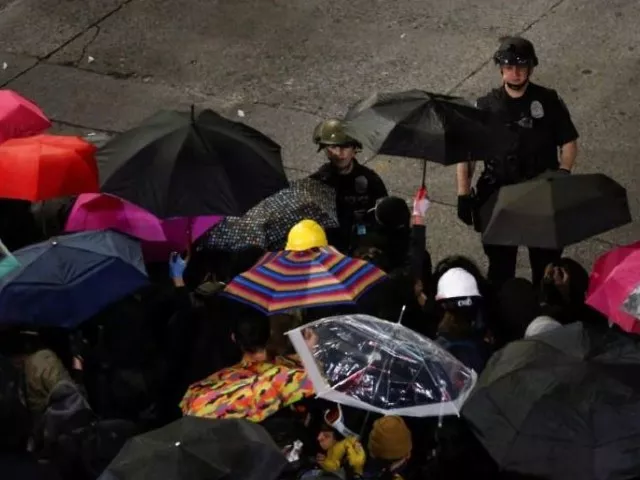 two seattle police officers talk to the line of protesters in the front of the barricade as protesters continue to rally early into the morning following the death in minneapolis police custody of george floyd near the department 039 s east precinct in seattle washington photo reuters two seattle police officers talk to the line of protesters in the front of the barricade as protesters continue to rally early into the morning following the death in minneapolis police custody of george floyd near the department 039 s east precinct in seattle washington photo reuters