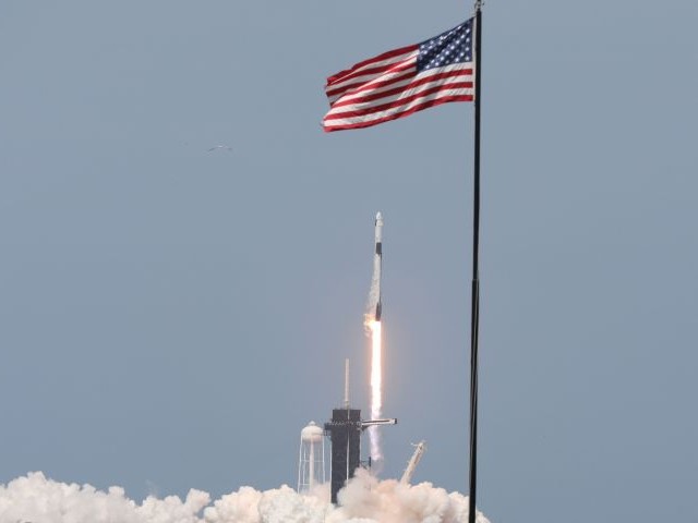 a spacex rocket carrying the crew dragon spacecraft lifts off at the kennedy space centre in florida on may 30 photo afp file