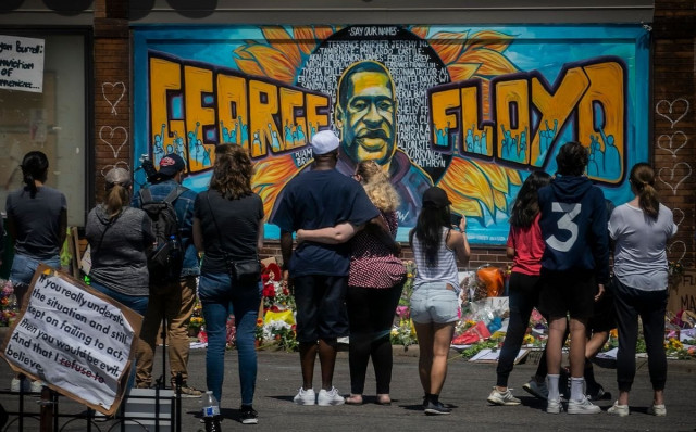 mandatory credit photo by bebeto matthews ap shutterstock 10665161c visitors make silent visits to organic memorial featuring a mural of george floyd near the spot where he died while in police custody in minneapolis minn america protests minneapolis united states   31 may 2020