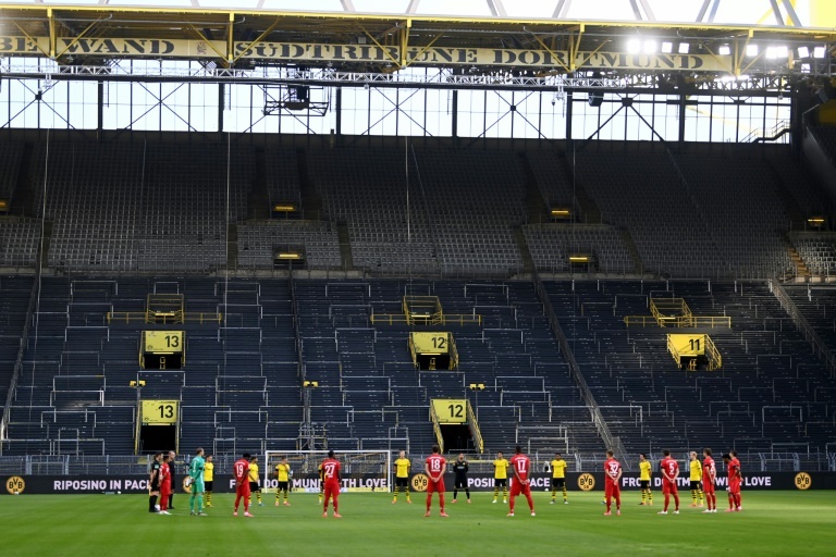 second placed borussia dortmund lost ground on leaders bayern munich late last month as the bavarians won 1 0 at an almost empty signal iduna park photo afp