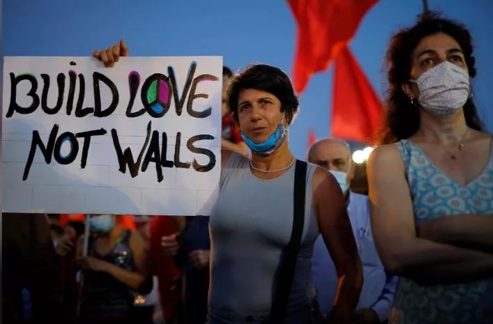 protesters gathered under the banner no to annexation no to occupation yes to peace and democracy photo reuters protesters gathered under the banner no to annexation no to occupation yes to peace and democracy photo reuters