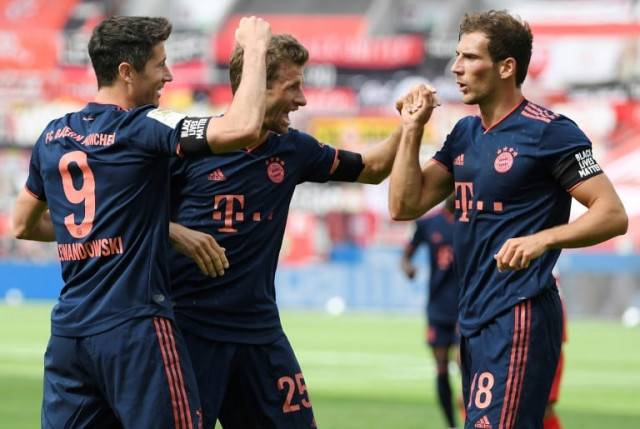 lewandowski scored his 30th league goal of the season as munich stay seven points ahead of second placed dortmund photo afp lewandowski scored his 30th league goal of the season as munich stay seven points ahead of second placed dortmund photo afp