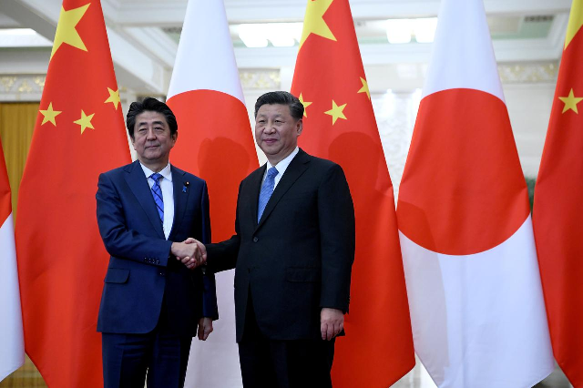 japan 039 s prime minister shinzo abe shakes hands with china 039 s president xi jinping at the great hall of the people in beijing china december 23 2019 photo reuters