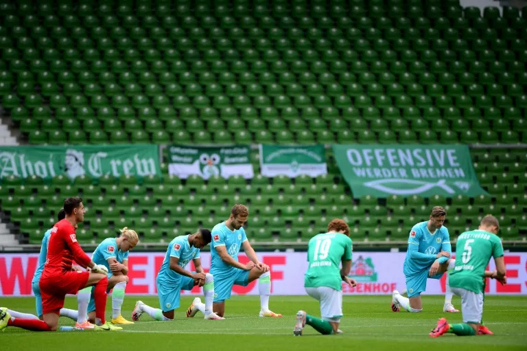 the match began after both starting elevens gathered round the centre circle at the weser stadium before dropping to one knee photo afp the match began after both starting elevens gathered round the centre circle at the weser stadium before dropping to one knee photo afp