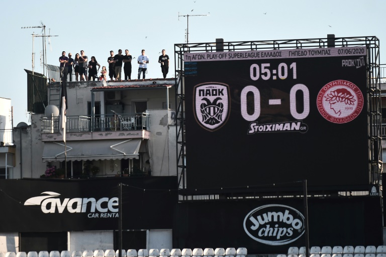 with spectators banned from the intimidating toumba stadium fans did their perilous best to still see the game photo afp