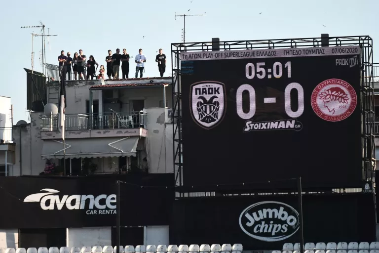 with spectators banned from the intimidating toumba stadium fans did their perilous best to still see the game photo afp with spectators banned from the intimidating toumba stadium fans did their perilous best to still see the game photo afp