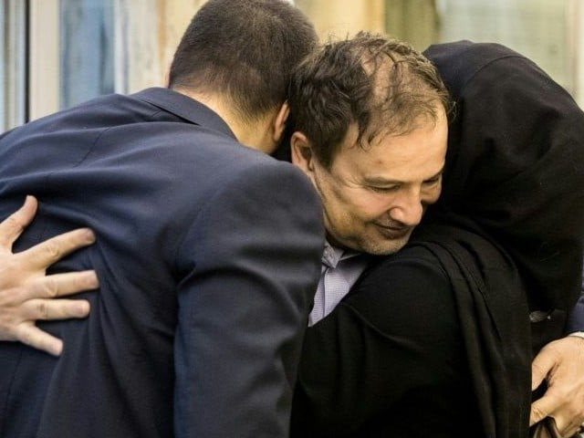 iran says scientist back home from us after prisoner swap iran says scientist back home from us after prisoner swap