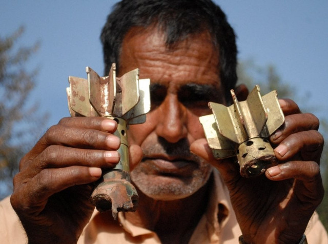 a man shows remains of an indian mortar shells photo afp file a man shows remains of an indian mortar shells photo afp file