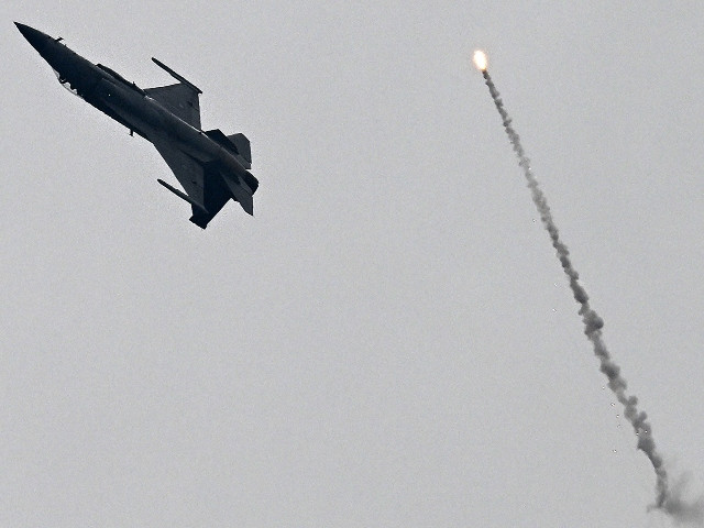Pakistan Air Force's F-16 fighter jet performs aerobatic maneuvers during Pakistan's national day parade in Islamabad on March 23, 2024. PHOTO: AFP