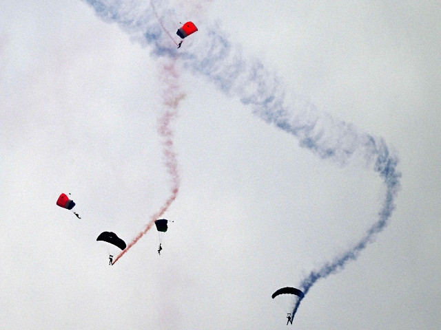 Pakistan Air Force paratroopers perform during Pakistan's national day parade in Islamabad on March 23, 2024. PHOTO: AFP