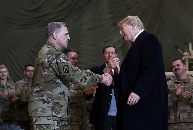us military chief regrets for role in trump s photo op