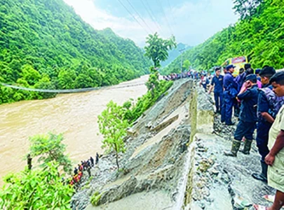 nepal landslide sweeps two buses into river