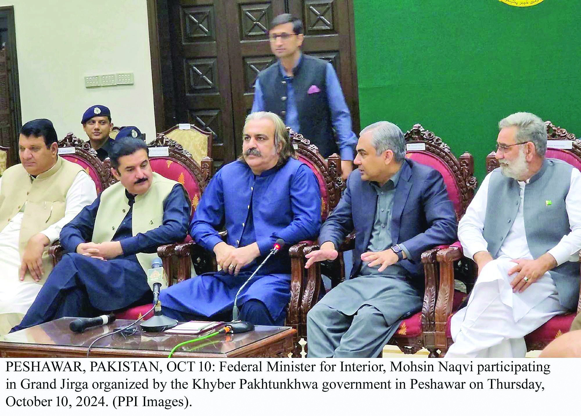 k p cm ali amin gandapur interior minister mohsin naqvi and others attend a grand jirga organised by the k p government in peshawar photo pp