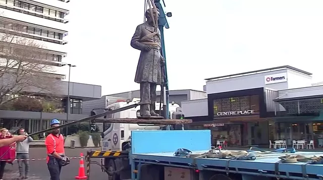 statue of british naval captain john fane charles hamilton is lifted out of the ground and onto a truck in hamilton new zealand june 12 2020 photo reuters