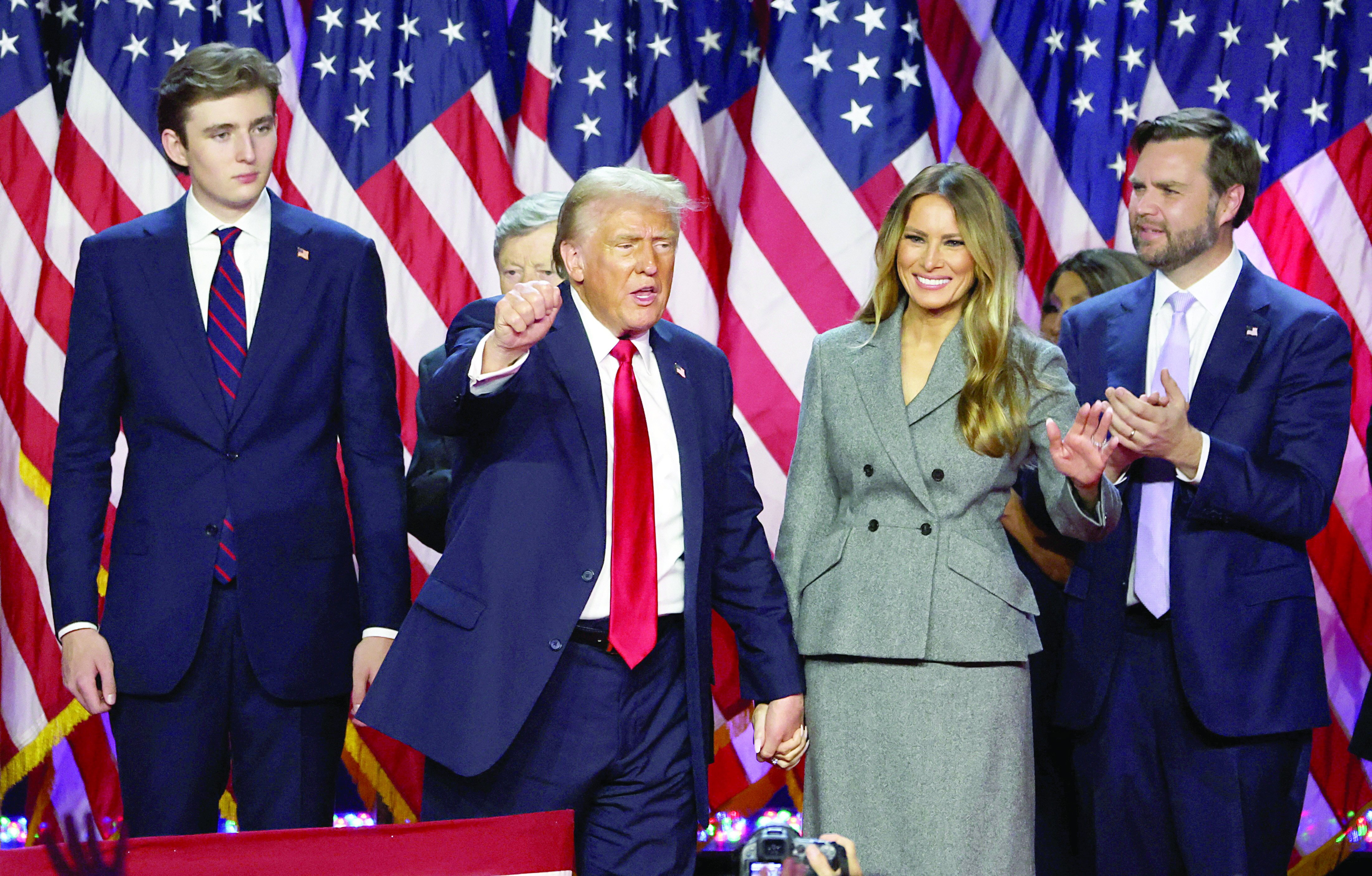 defying odds predictions us president elect donald trump gestures next to his wife melania trump son barron trump and re publican vice presidential nominee jd vance in palm beach county convention center in west palm beach florida photo reuters