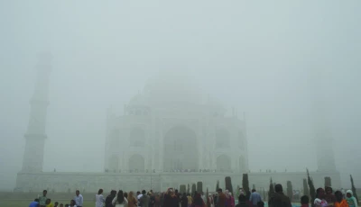 visitors look toward the taj mahal through morning air pollution and fog in agra photo reuters