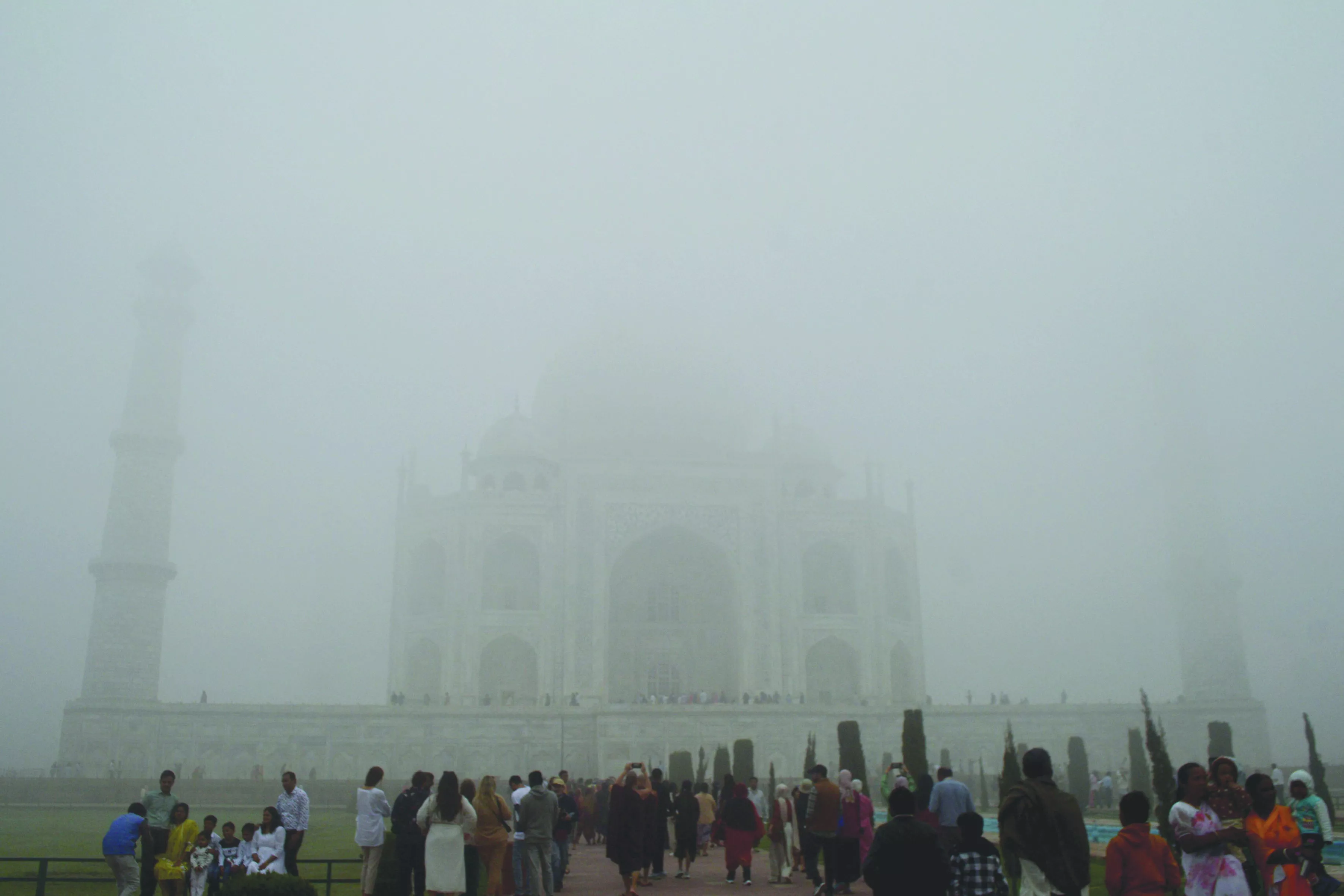 visitors look toward the taj mahal through morning air pollution and fog in agra photo reuters visitors look toward the taj mahal through morning air pollution and fog in agra photo reuters
