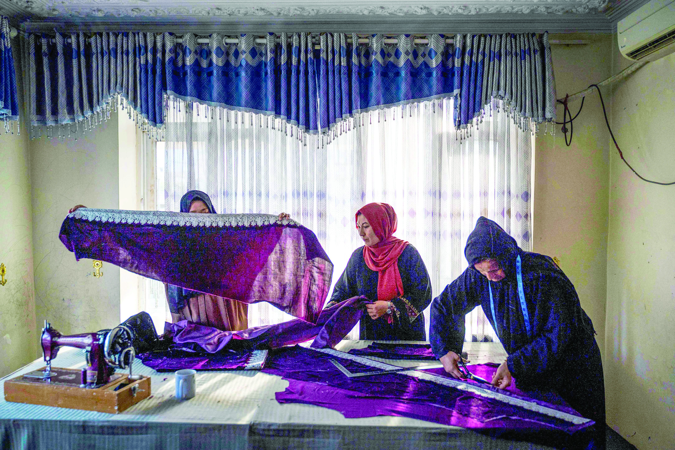 afghan women sew clothes at a handicraft workshop in kabul many women have launched small businesses in the past three years to meet their own needs and support other afghan women photo afp