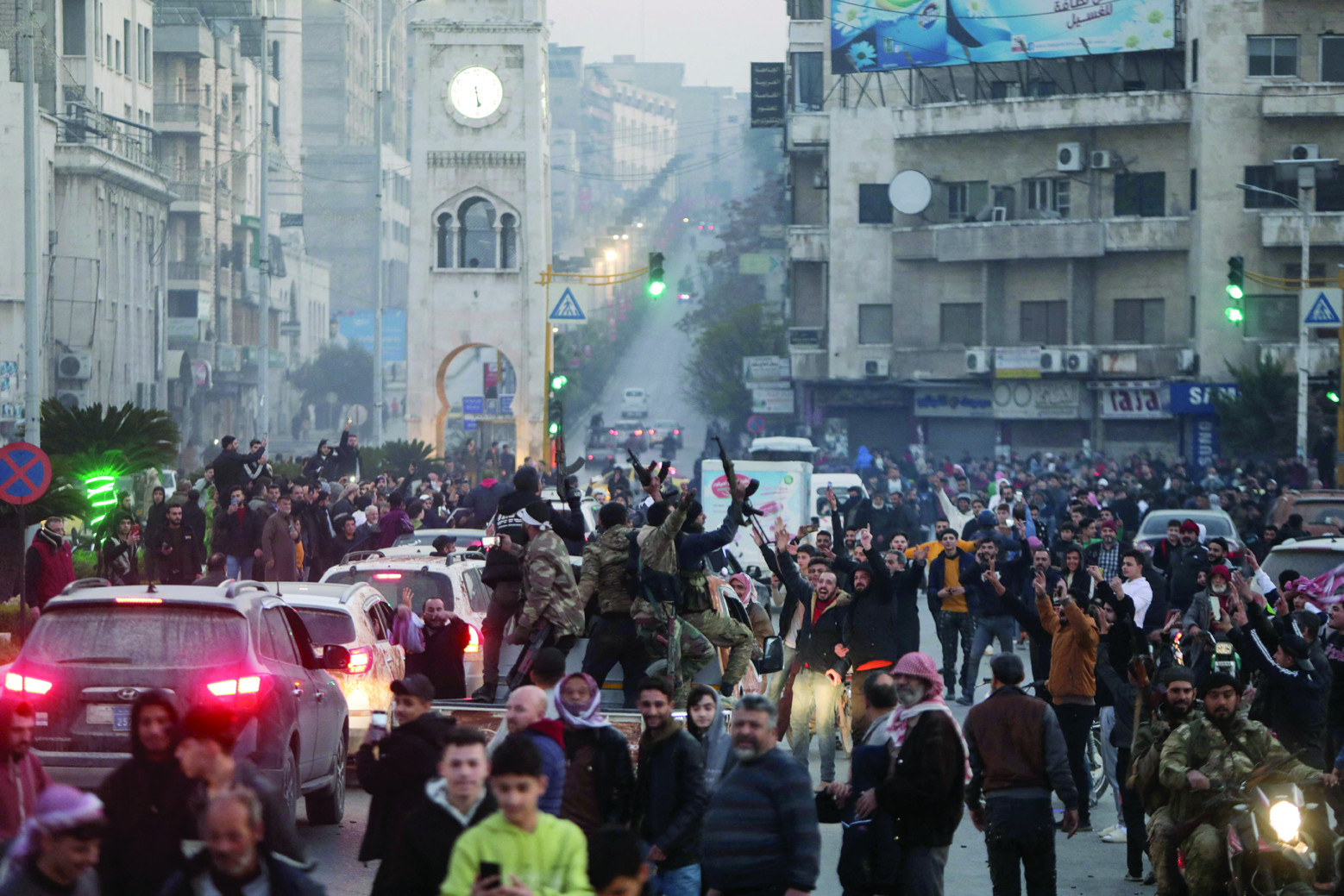 residents take to the streets of hama to welcome anti government fighters after they took control of syria s west central city photo afp