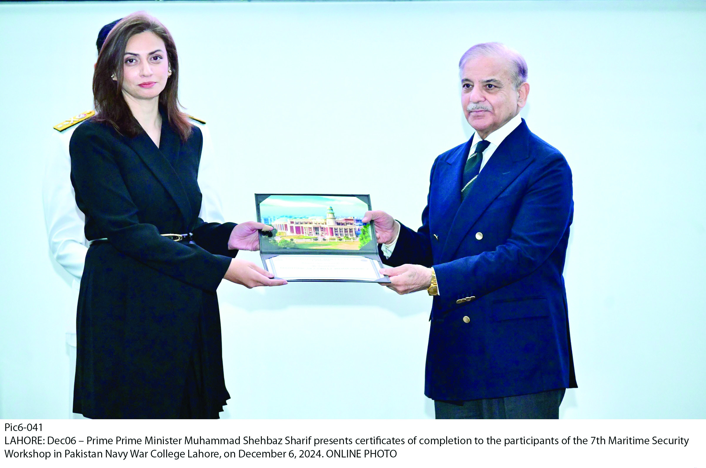 pm shehbaz sharif presents a certificate to a participant of the 7th maritime security workshop in lahore photo app