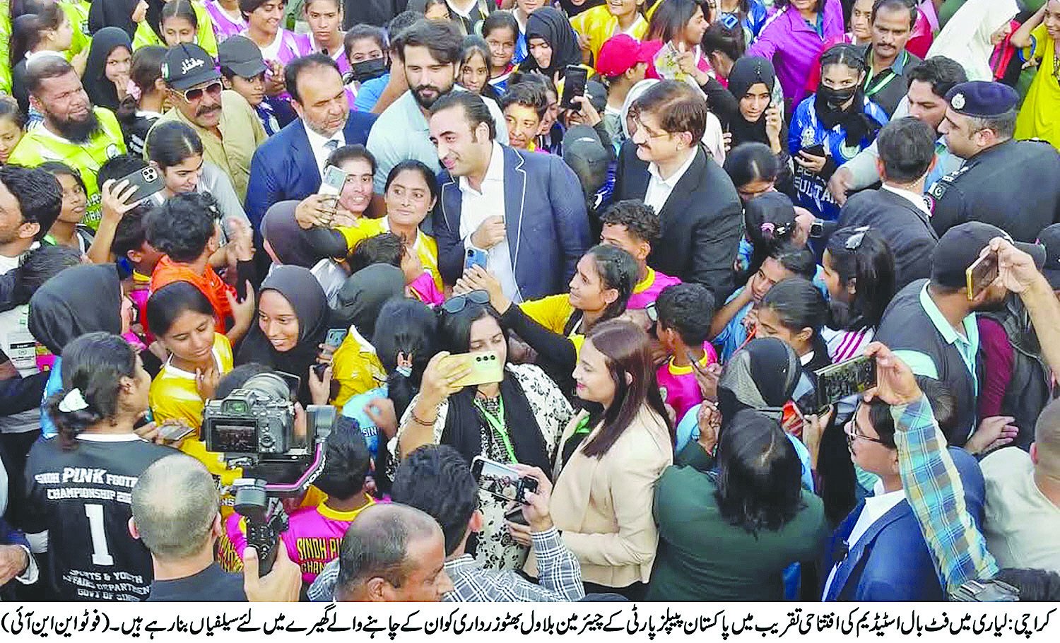 athletes take selfies with ppp chairman bilawal zardari at the opening of pink football tournament at lyari international football ground on friday photo nni