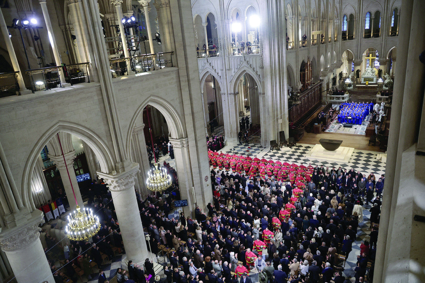 french firefighters attend the reopening ceremony of the notre dame de paris cathedral in paris photo reuters