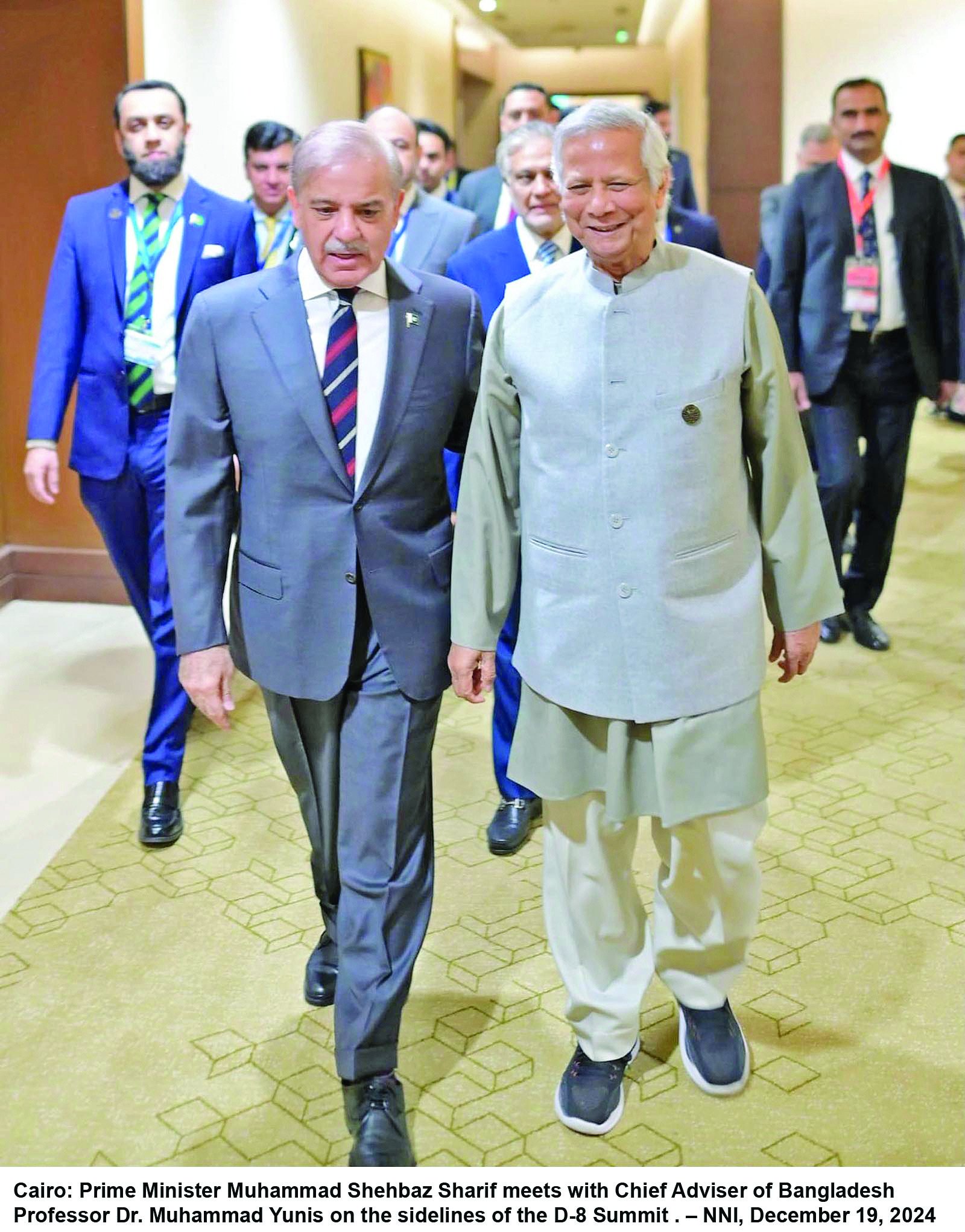 pm shehbaz sharif walks with bangladesh chief adviser dr muhammad yunis during a meeting on the sidelines of the d 8 summit in cairo photo nni