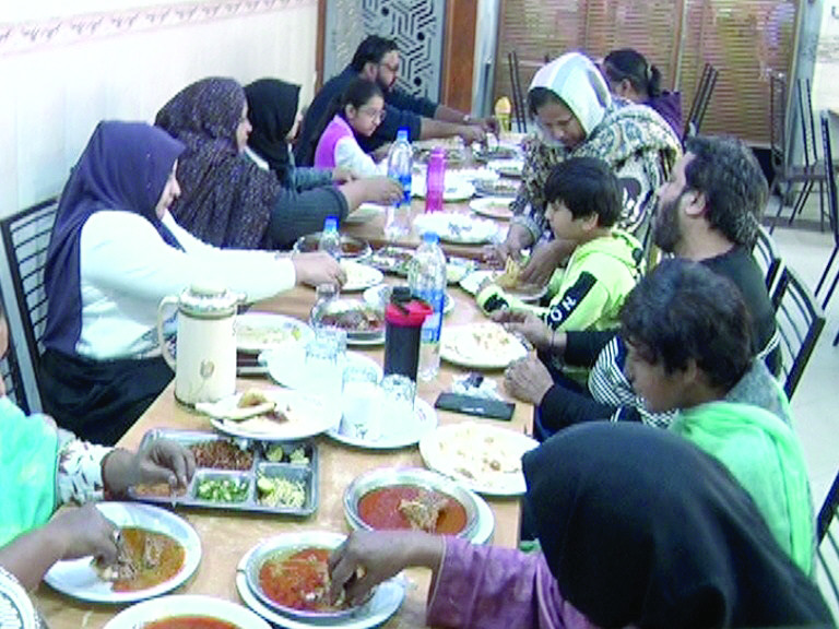 a family enjoys desi delights like nihari and paya at an eatery on a cold morning in the city photo express