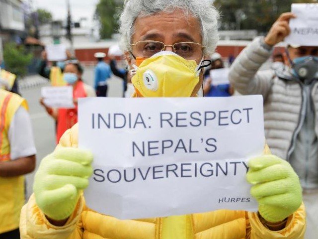 activists affiliated with 039 human rights and peace society nepal 039 holding placards protest against the alleged encroachment of nepal 039 s border by india in the far west of nepal near the indian embassy in kathmandu nepal may 12 2020 photo reuters file