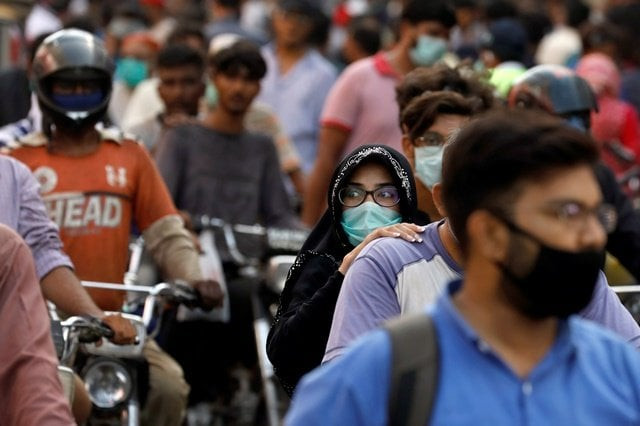 file photo a woman rides on a motor bike as she wears a protective face mask amid the rush of people outside a market as the outbreak of the coronavirus disease covid 19 continues in karachi pakistan june 8 2020 reuters file photo a woman rides on a motor bike as she wears a protective face mask amid the rush of people outside a market as the outbreak of the coronavirus disease covid 19 continues in karachi pakistan june 8 2020 reuters