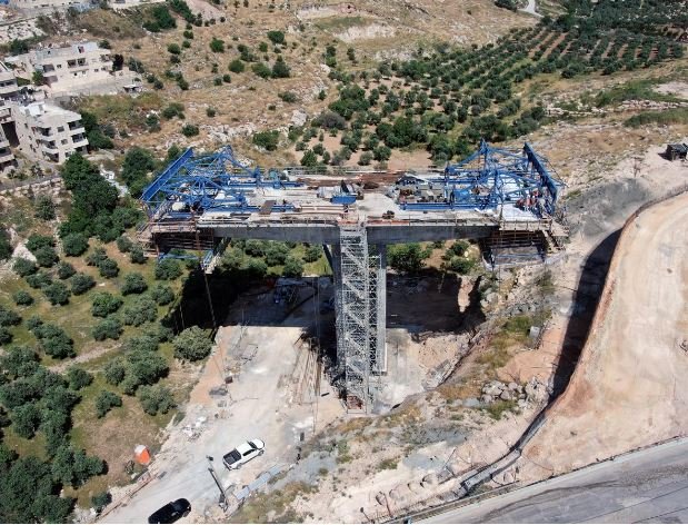 an aerial view shows a bridge under construction as part of the american road an israeli ring road that is being built through east jerusalem the construction is in sur baher a palestinian neighbourhood of east jerusalem may 10 2020 picture taken with a drone photo reuters