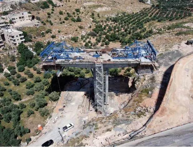 an aerial view shows a bridge under construction as part of the american road an israeli ring road that is being built through east jerusalem the construction is in sur baher a palestinian neighbourhood of east jerusalem may 10 2020 picture taken with a drone photo reuters an aerial view shows a bridge under construction as part of the american road an israeli ring road that is being built through east jerusalem the construction is in sur baher a palestinian neighbourhood of east jerusalem may 10 2020 picture taken with a drone photo reuters