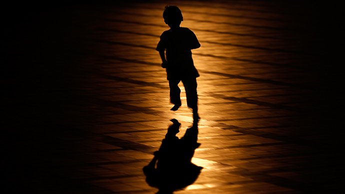 a child running in the shadows photo reuters