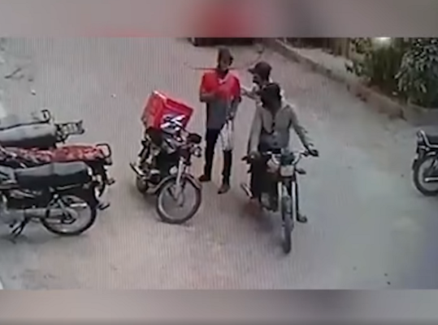 cctv footage shows muggers trying to snatch delivery boy 039 s belongings at gun point screengrab cctv footage shows muggers trying to snatch delivery boy 039 s belongings at gun point screengrab