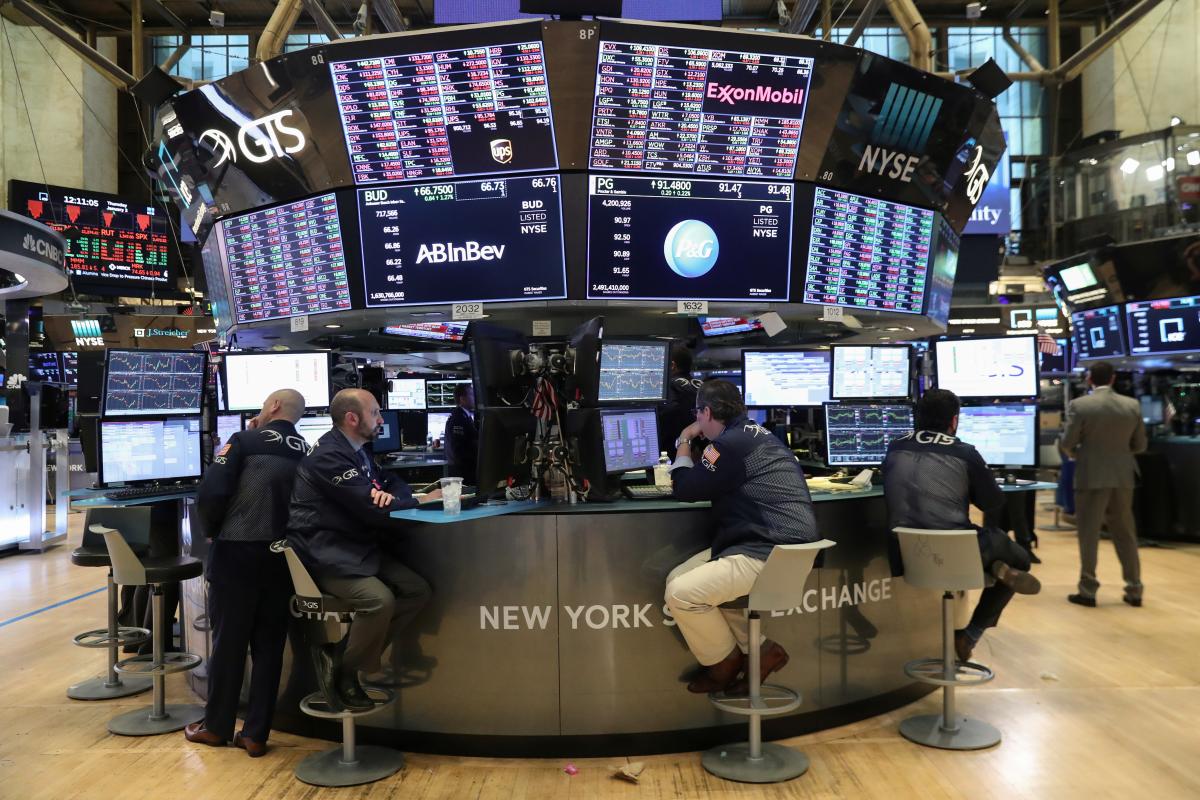 traders look at price monitors as they work on the floor at the new york stock exchange nyse in new york city photo reuters