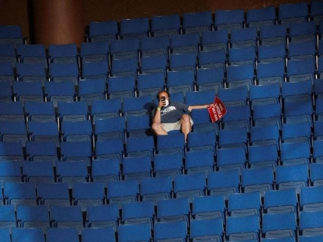 a supporter of us president donald trump shoots a video with his mobile phone from the sparsely filled upper decks of the arena as the president addresses his first re election campaign rally in several months in the midst of the coronavirus disease covid 19 outbreak at the bok centre in tulsa oklahoma us photo reuters file a supporter of us president donald trump shoots a video with his mobile phone from the sparsely filled upper decks of the arena as the president addresses his first re election campaign rally in several months in the midst of the coronavirus disease covid 19 outbreak at the bok centre in tulsa oklahoma us photo reuters file