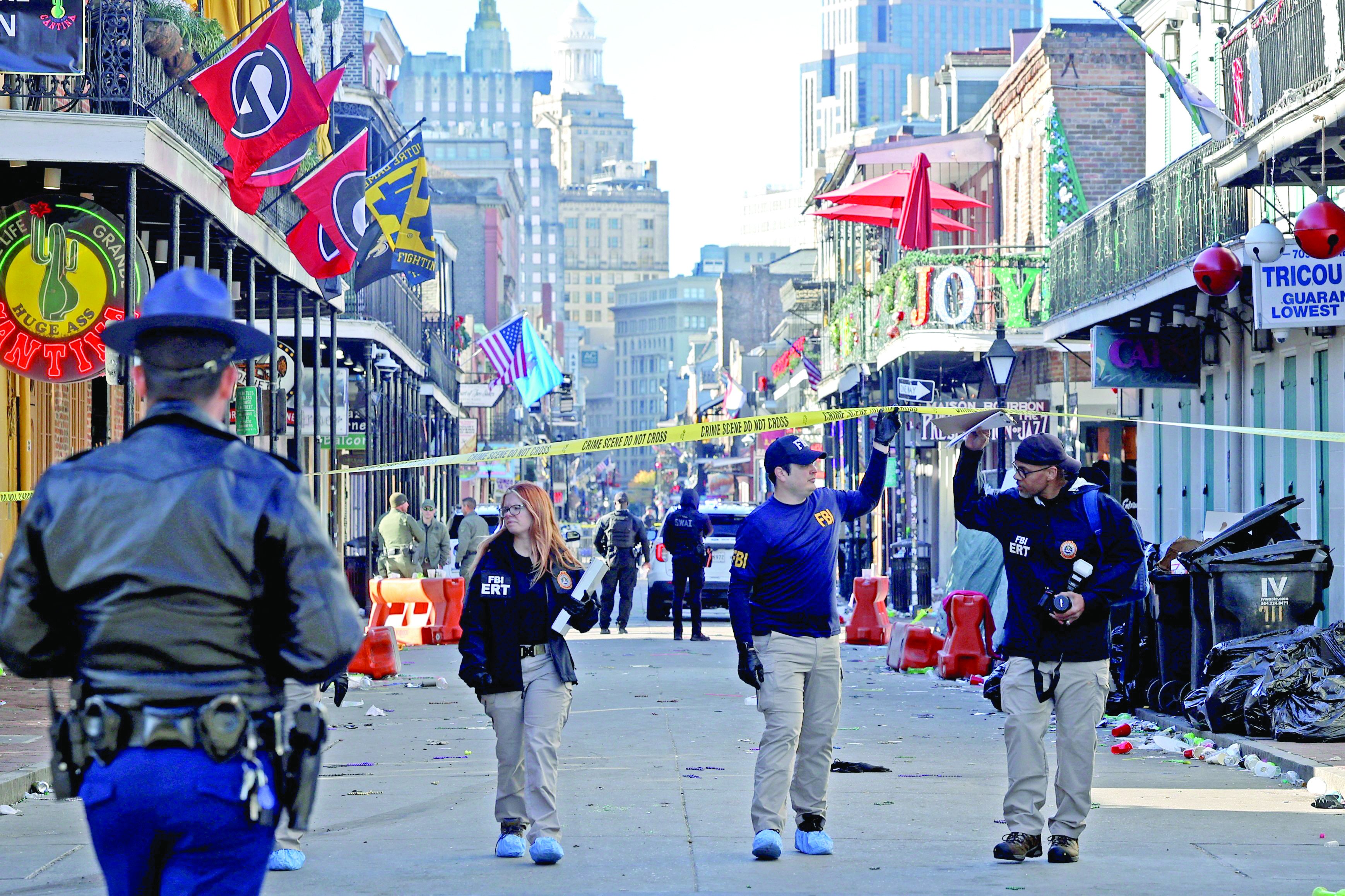 law enforcement officers work the scene after a person allegedly drove into the crowd in new orleans louisiana photo afp