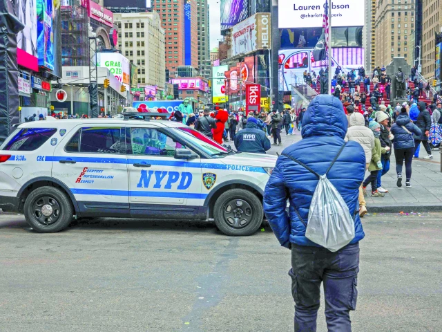 people walk through times square in manhattan photo afp